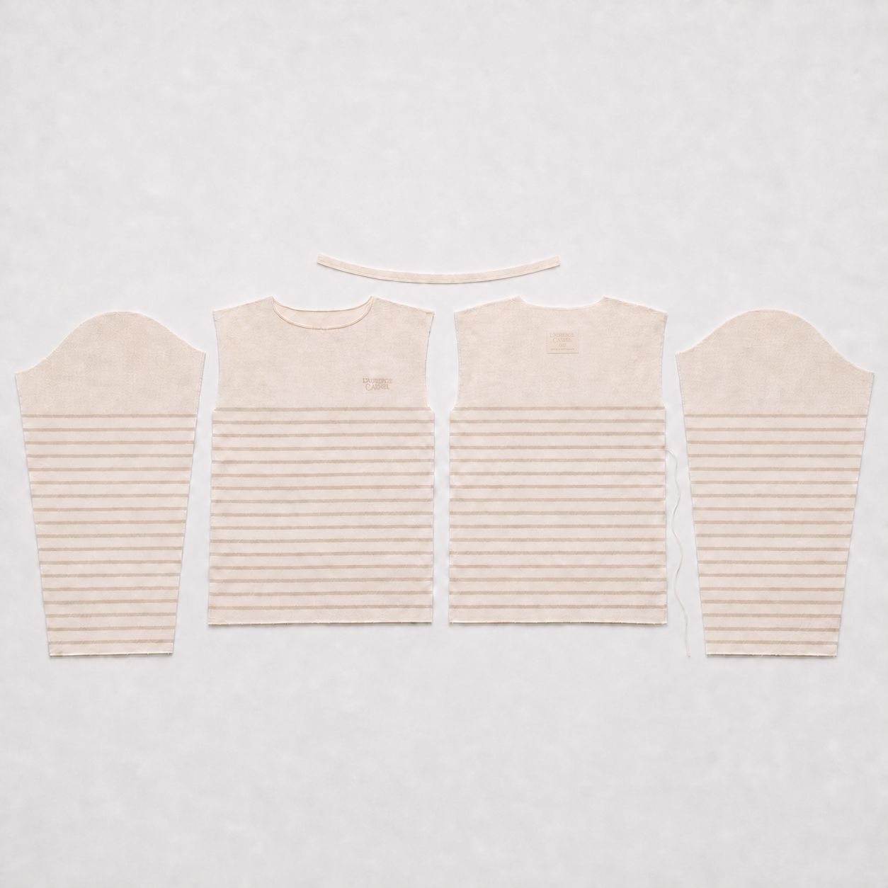 Exploded view of the Breton mid-assembly — panels, binding and label separated.