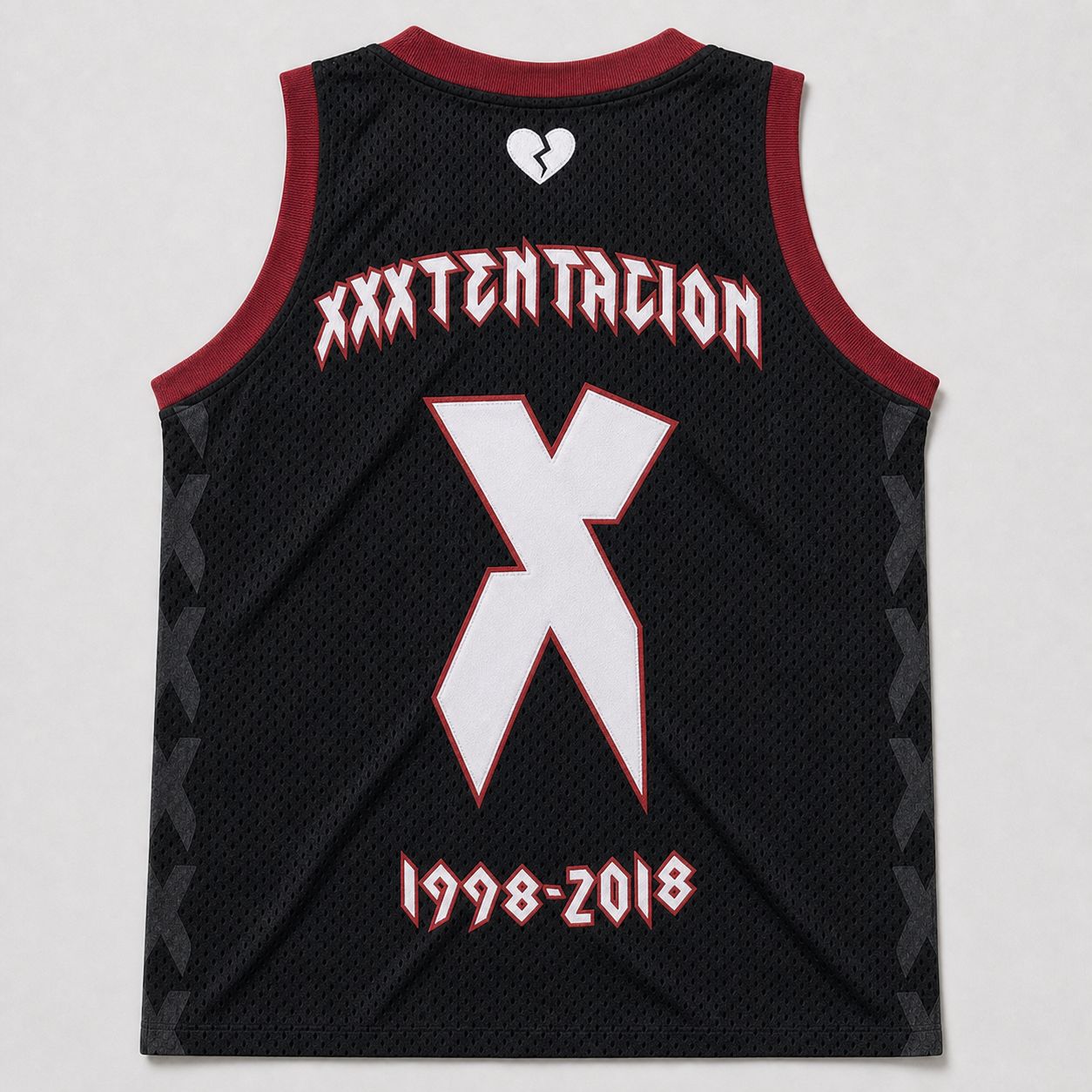 XXXTENTACION basketball jersey, back — arced wordmark, large X and 1998–2018 in tackle twill, maroon rib-knit trim.