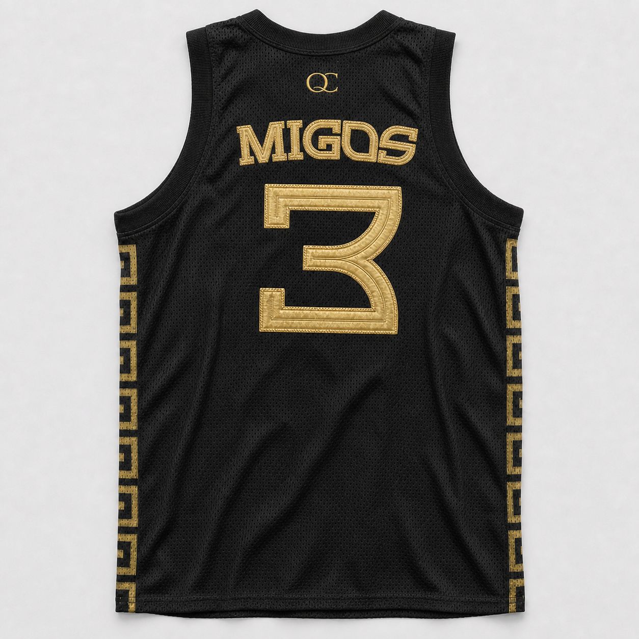 Migos basketball jersey by Studio ATM, back — metallic gold tackle twill MIGOS and 3, gold QC embroidery at top center.