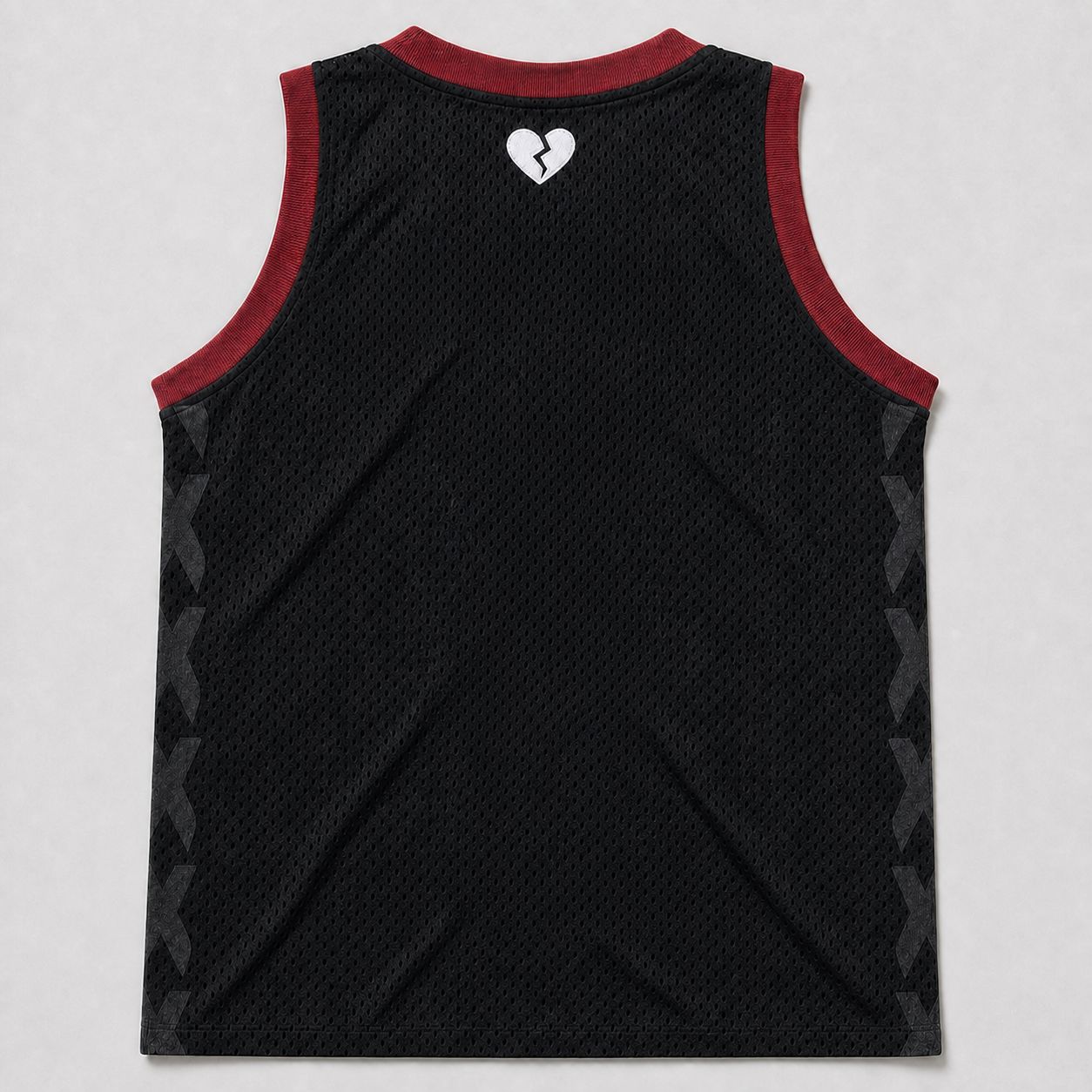 Jersey body before twill application, back — black mesh, maroon rib-knit trim, tonal DTF side X's, embroidered heart below the neck.