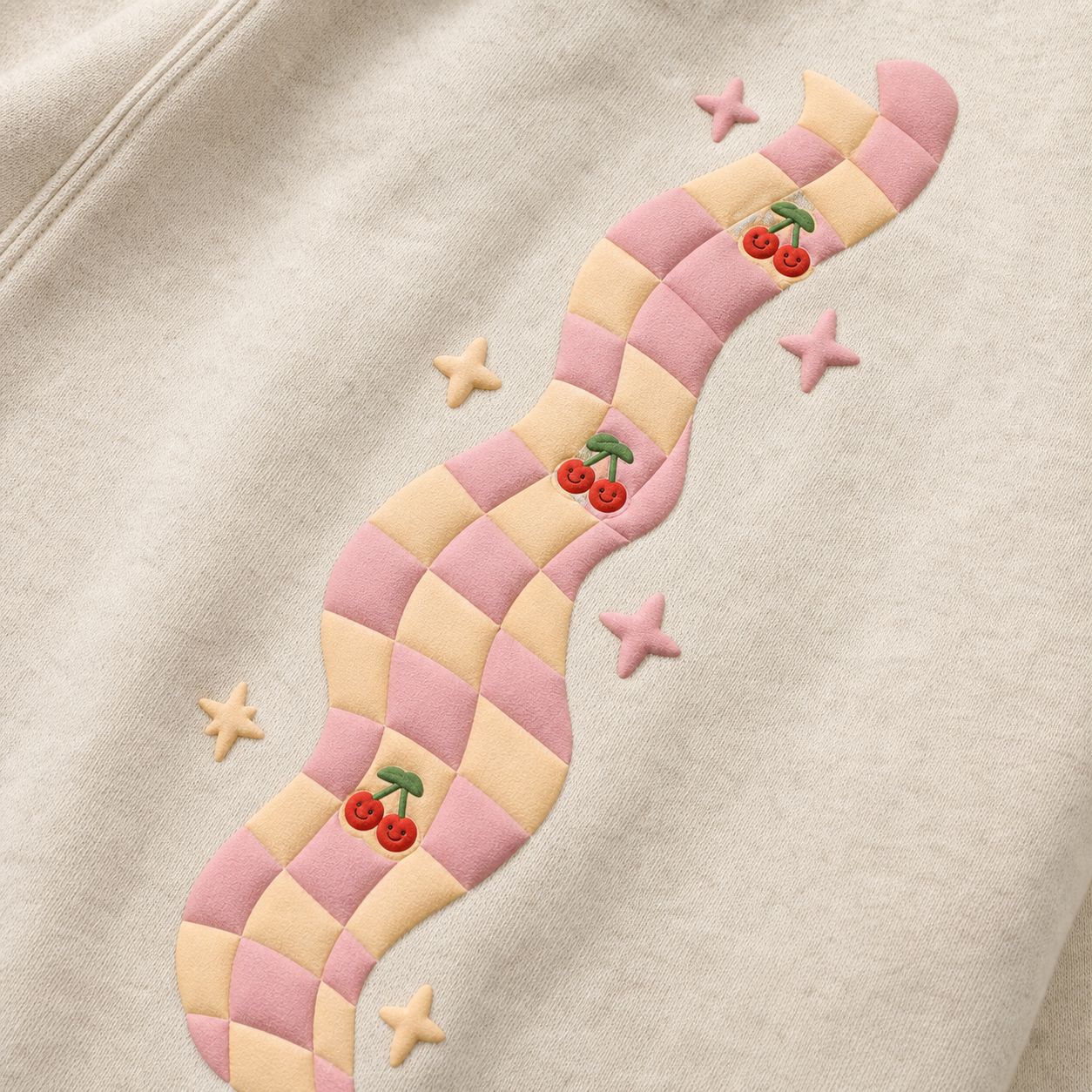 Pink-and-butter wavy checkerboard puff ribbon with smiley cherries and sparkle stars, macro.