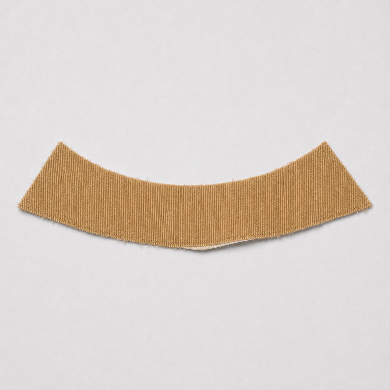 Tan-brown wale corduroy collar piece, cut and unattached.