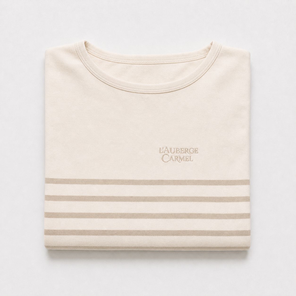 L'Auberge Carmel Breton long-sleeve folded, wordmark embroidery centered.