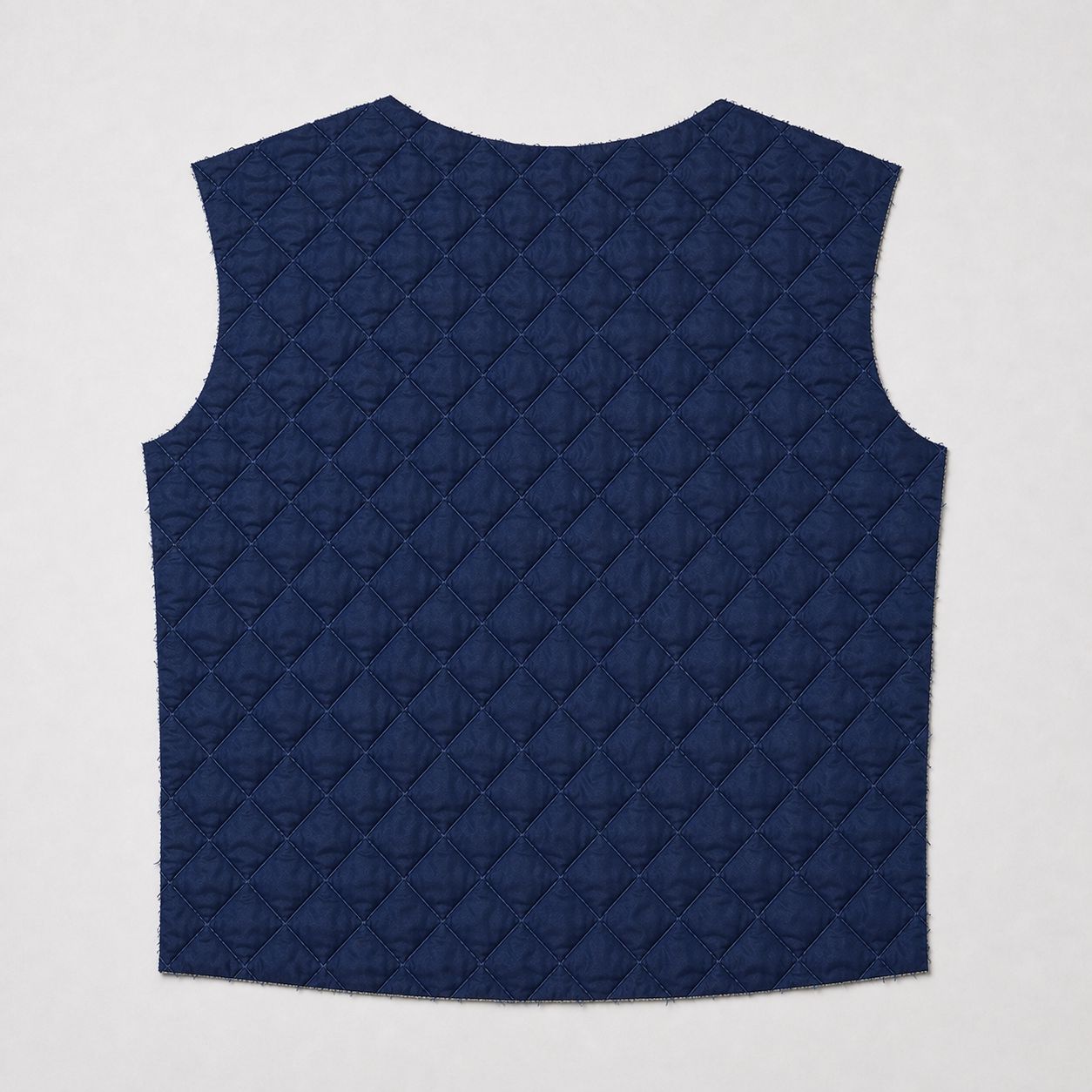 Navy diamond-quilted lining panel, pre-assembly.