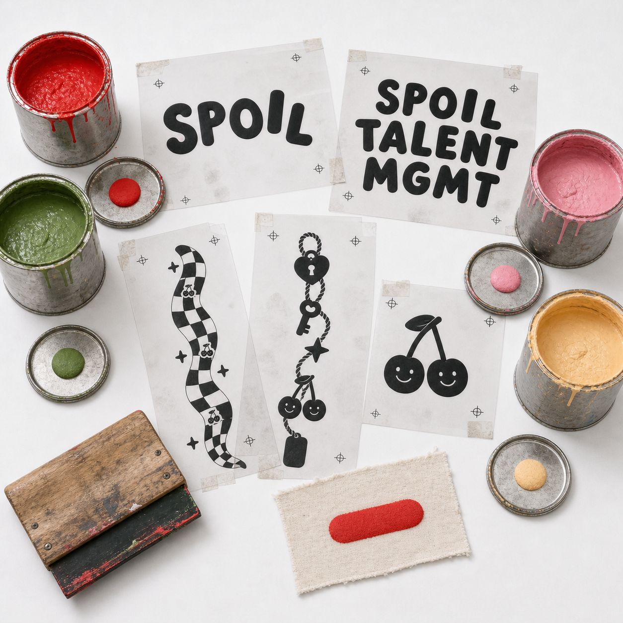 Film positives, puff ink quarts in the four colors, squeegee, and a risen red test swatch.