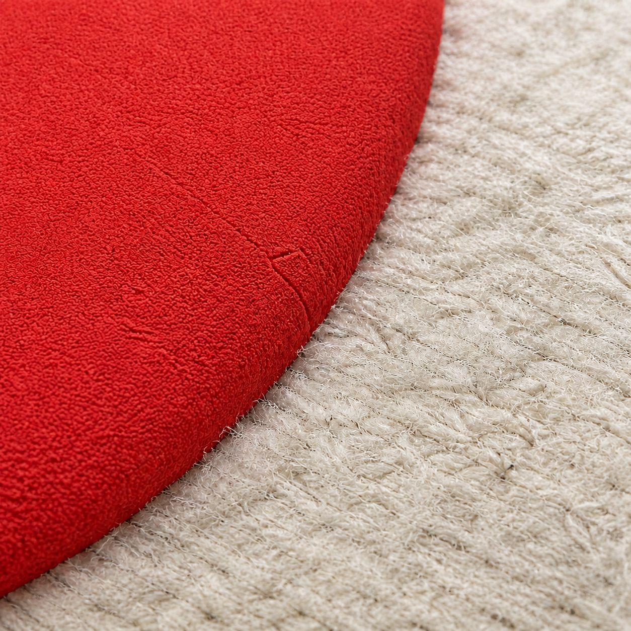 Extreme macro of the risen puff ink edge — rounded loft and matte skin against the fleece loops.