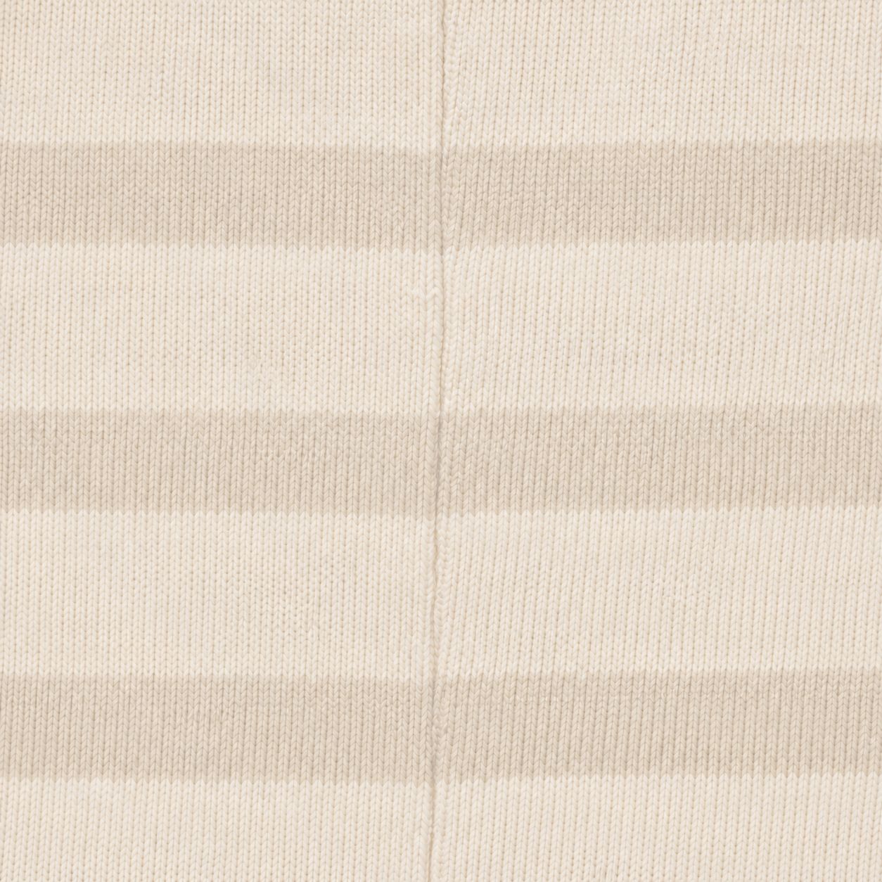 Low-contrast yarn-dyed stripes matched at the side seam, macro.