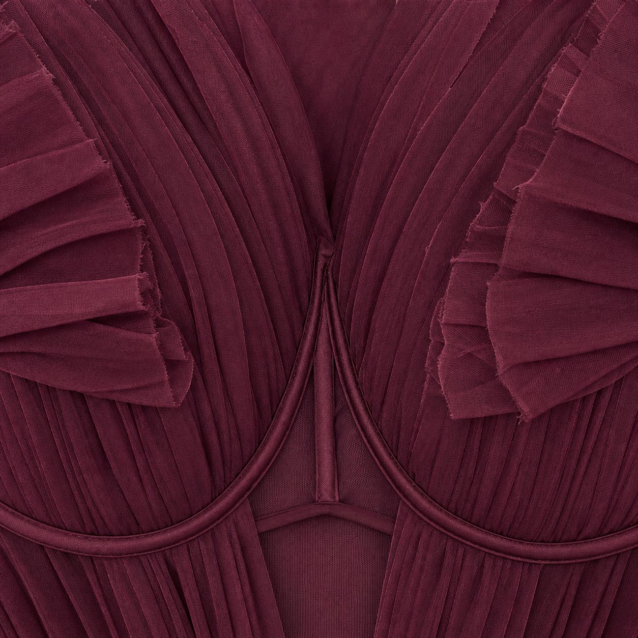 Macro of the Dahlia gown center front - pleated petal cups converging at the piped underwire