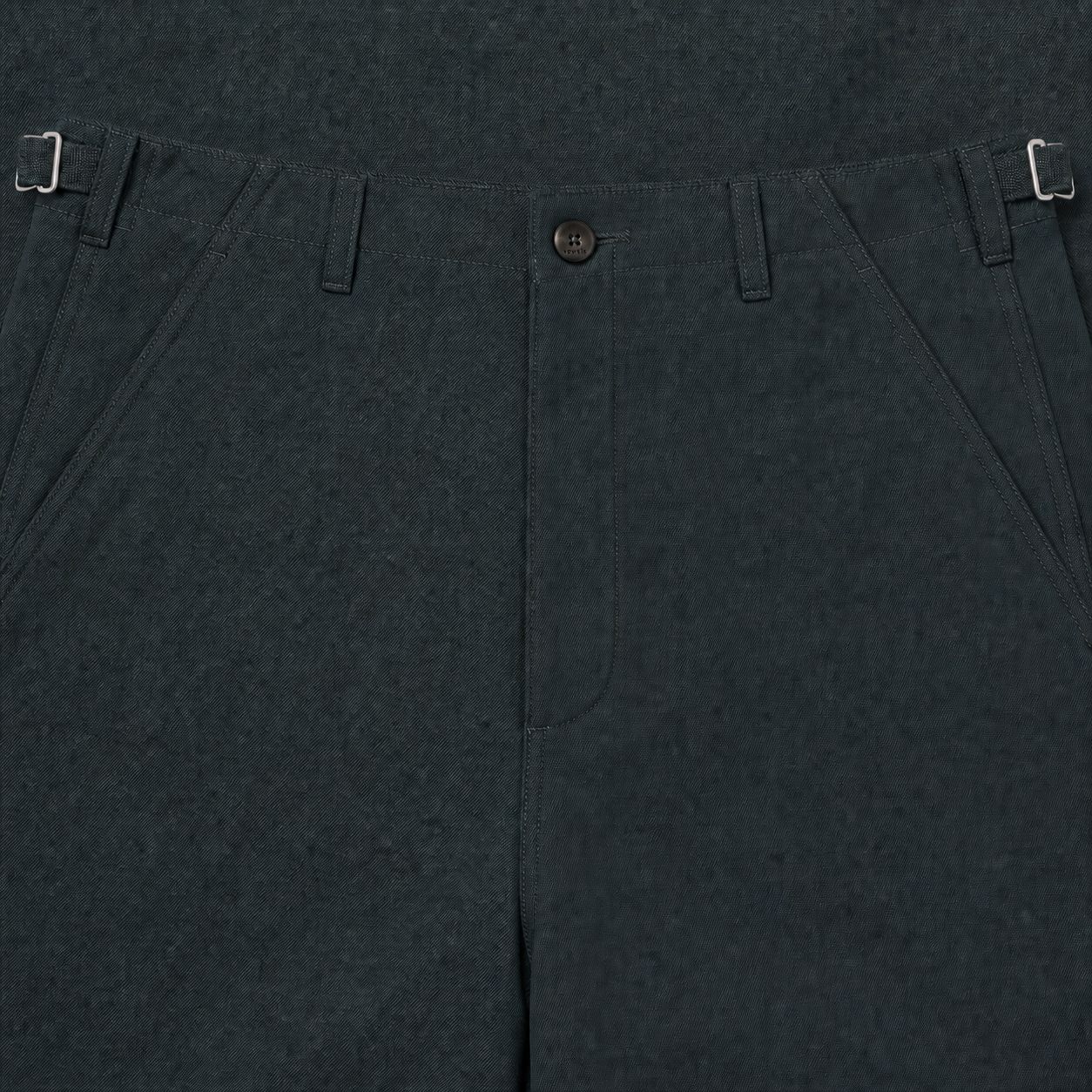 Macro of the engraved vowels button and grosgrain ladder-lock waist adjuster on the Zip-Off Cargo Pants