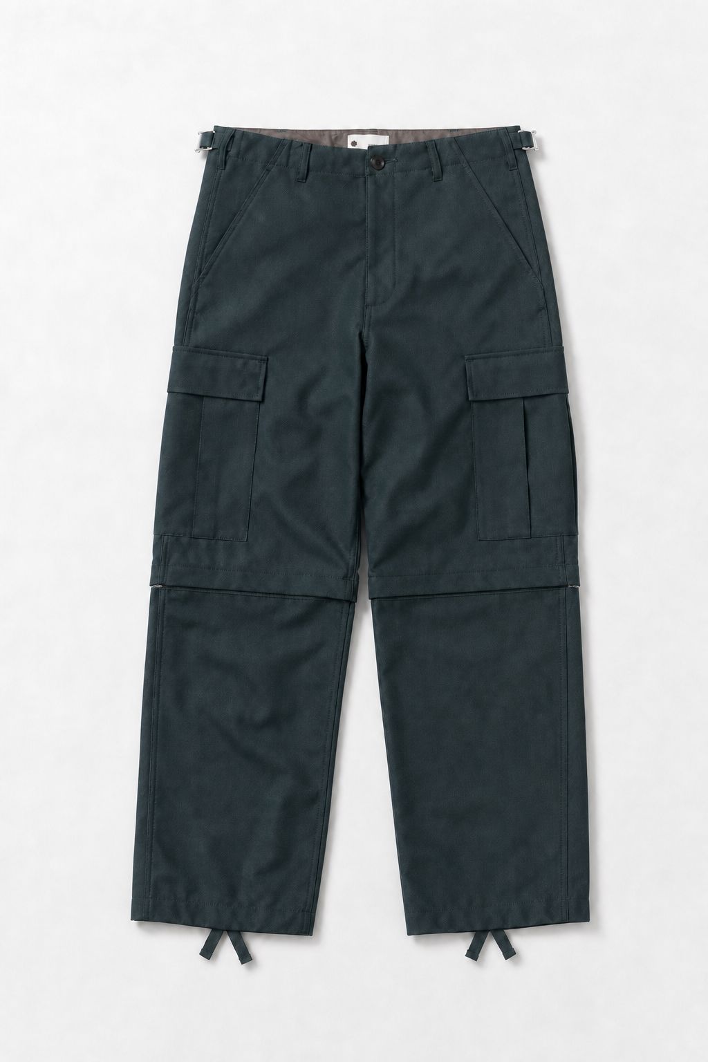 vowels Zip-Off Cargo Pants in Dark Forest by Studio ATM - flat lay, front, full length with knee conversion zips and side-tab waist adjusters