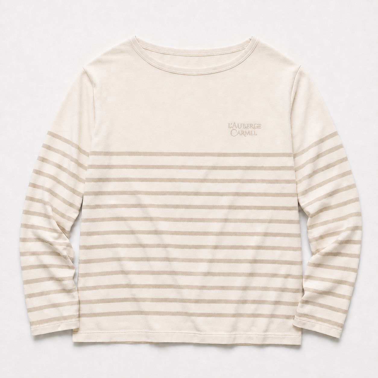 L'Auberge Carmel Breton long-sleeve by Studio ATM — low-contrast stripes, stone-beige chest embroidery.