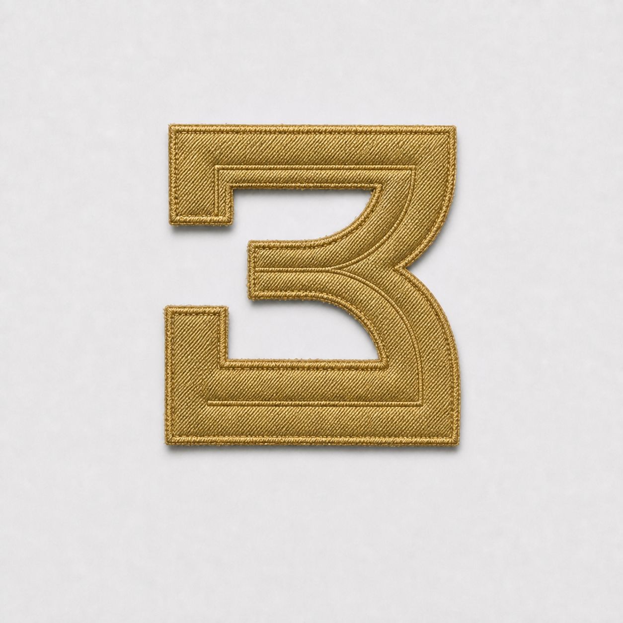 Cut metallic gold tackle twill number 3, pre-application.