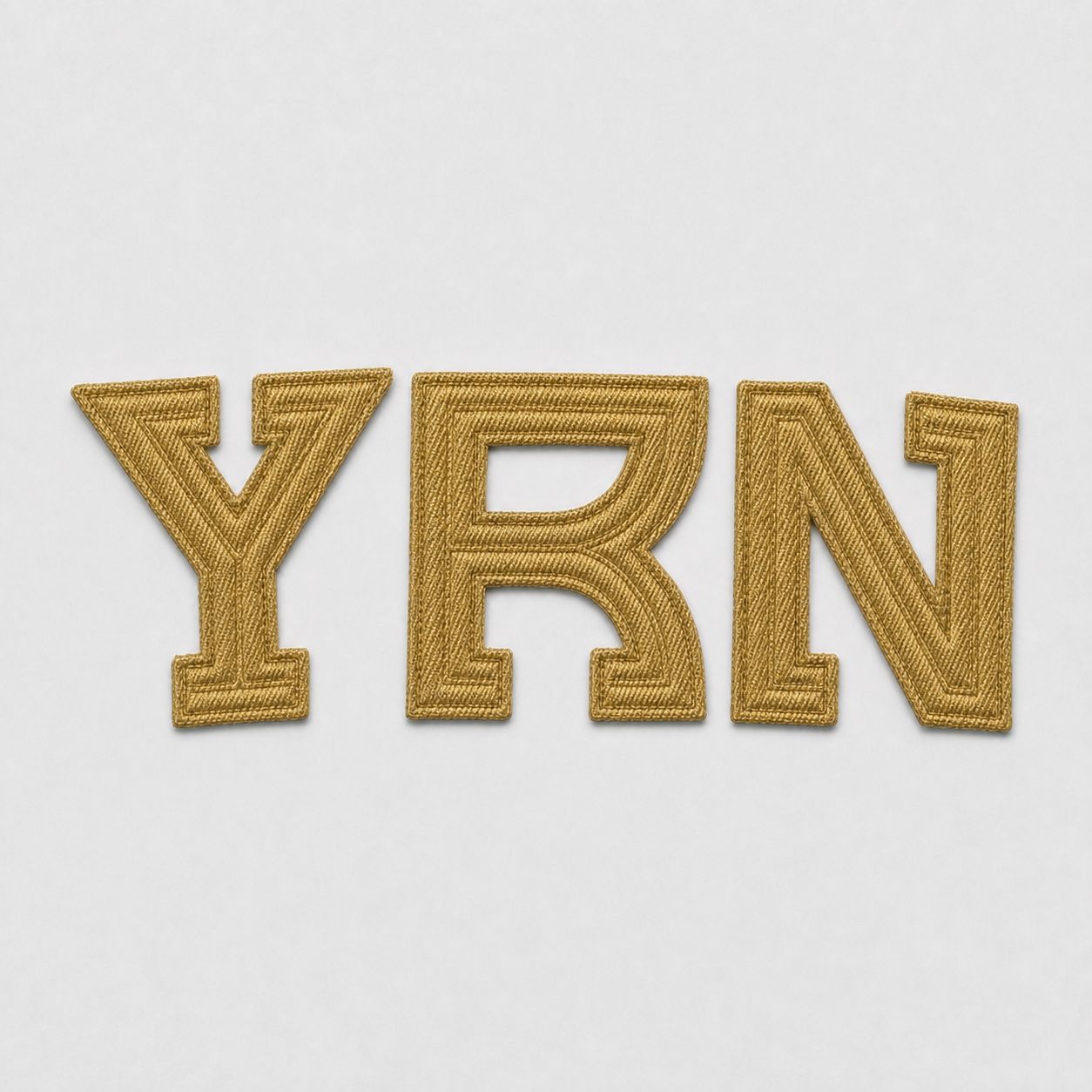 Cut metallic gold tackle twill YRN arc, pre-application.